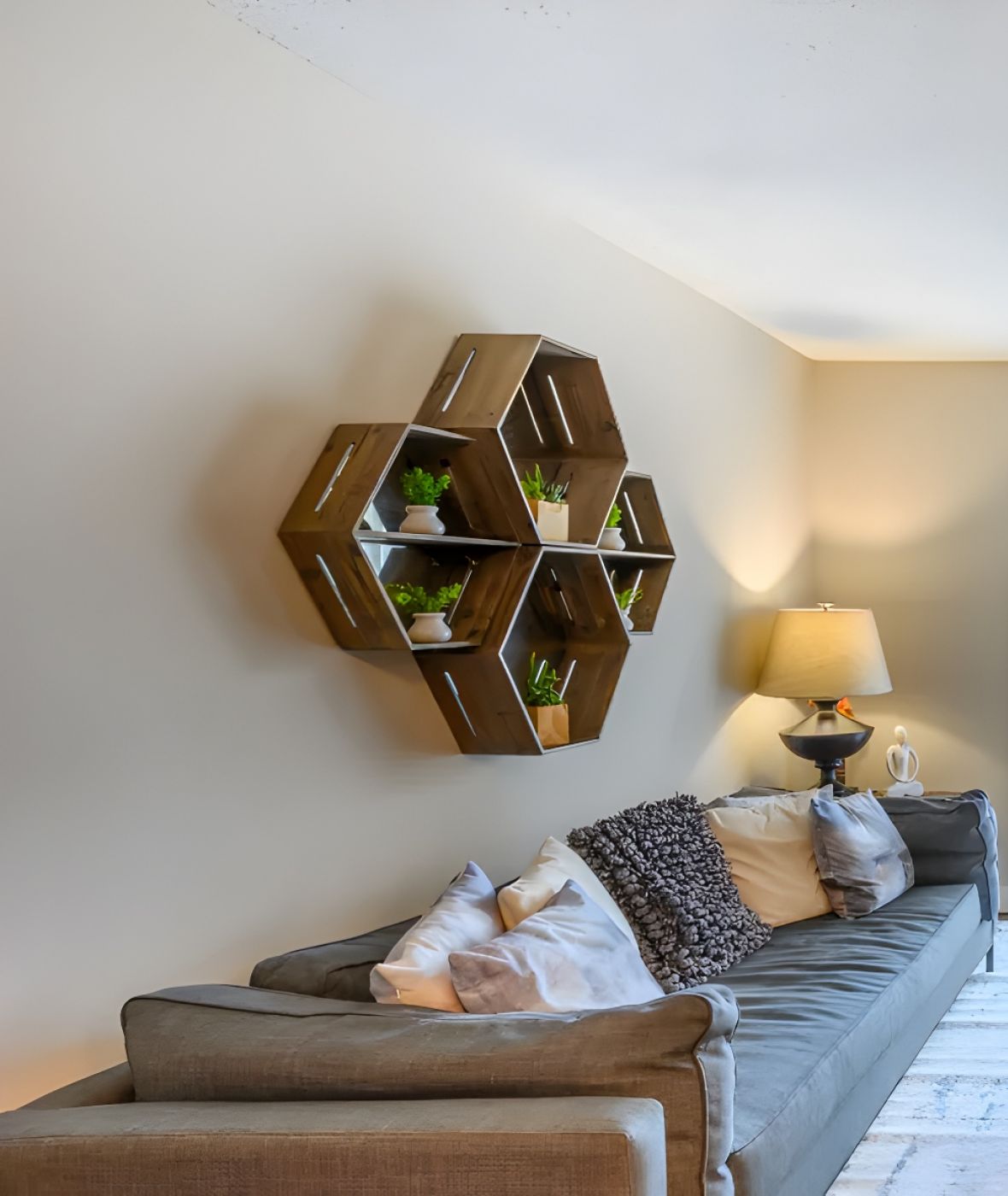 The Amber at Greenbrier A bright living room with a gray sofa, armchair, TV, and glass doors opening to a patio.